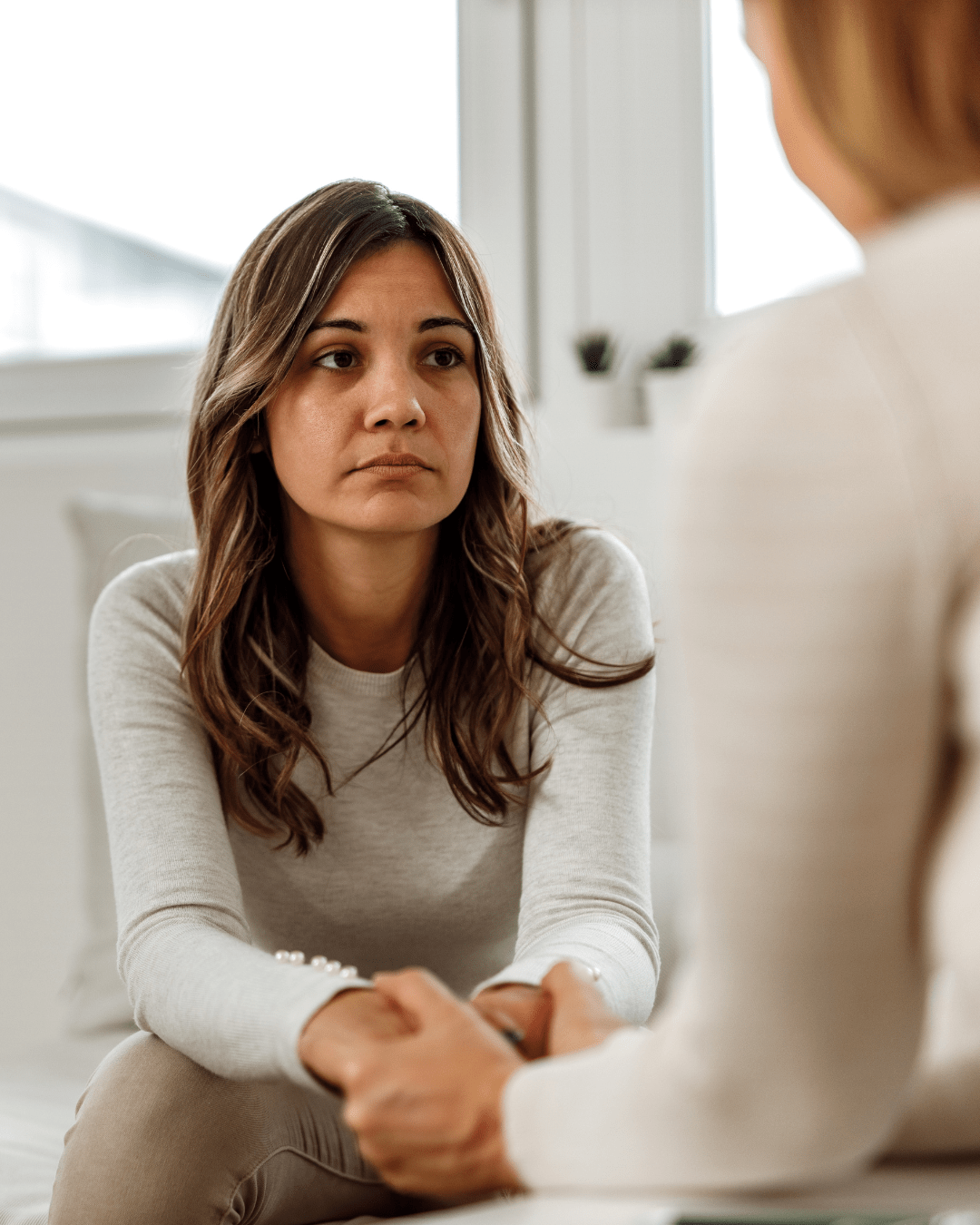 A client on the phone at home, reviewing her care plan